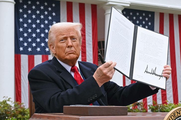 U.S. President Donald Trump holds a signed executive order after delivering remarks on reciprocal tariffs during an event in the Rose Garden entitled 'Make America Wealthy Again' at the White House in Washington, DC, on Apr. 2, 2025. AFP-Yonhap